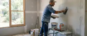 Empire Interior Plastering | Plasterer Campbelltown: What Local Homeowners Should Know Before You Renovate Plasterer campbelltown tradesperson applying skim coat to plasterboard wall during a home renovation